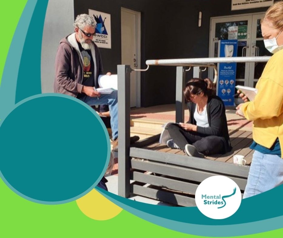 Mental health skill set workshop participants in discussions outdoors as part of a training exercise.